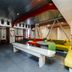 Botel Marina in Rijeka lounge with colorful seating, long bench table, and industrial-style ceiling
