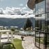 Schlosshotel Fiss in Fiss with mountain views, a terrace, cabana, and outdoor pool beside glass walls