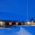 Hakkesetstølen Fjellstugu in Geilo at dusk, snow-covered lodge with glowing windows and mountain backdrop