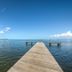 506 Little Harbor Inn dock extending into calm water under a clear blue sky in Ruskin