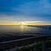 Sunset over the water with a pier at 506 Little Harbor Inn, Ruskin