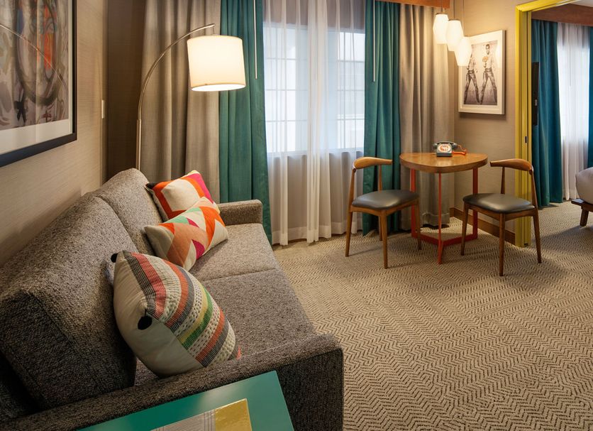 The Kinney - Venice Beach room in Los Angeles with sofa, desk, TV, and colorful accents