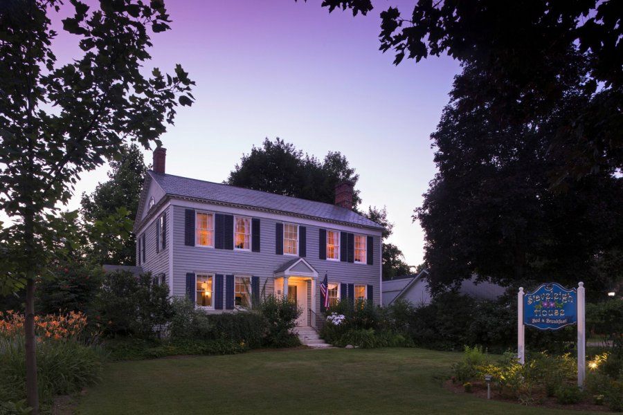Staveleigh House Bed & Breakfast in Sheffield, lit at dusk with a garden and sign outside