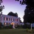 Staveleigh House Bed & Breakfast in Sheffield, lit at dusk with a garden and sign outside