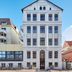 Strandhotel VierJahresZeiten in Borkum, a white multi-story building with a central entrance
