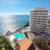 Duas Torres Hotel in Funchal with ocean view, pool, and high-rise tower overlooking the coast