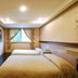 Alishan Shermuh Hotel in Chiayi City guest room with two beds and a window with curtains