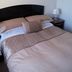 Beachgate House, Stonehaven guest room with double bed, bedside tables and wall art