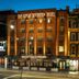 Great Southern Hotel Sydney in Sydney, brick facade at dusk with illuminated streetfront