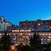 Arcadia Hotel in Odesa with illuminated facade and city skyline at dusk