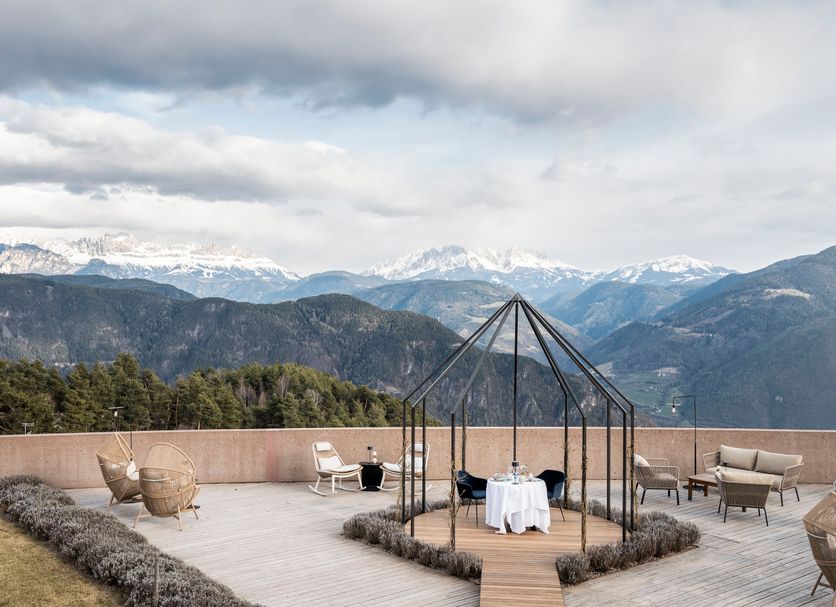 Hotel Belvedere terrace dining pavilion with mountain views in San Genesio Atesino/Jenesien