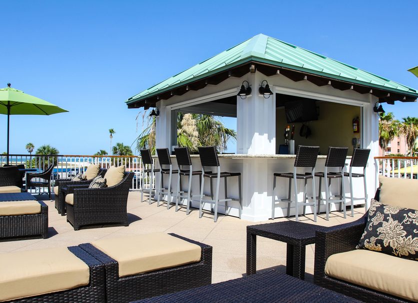 Treasure Island Hotel and Marina rooftop bar with lounge seating and ocean view in Treasure Island