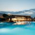 Nana Golden Beach in Hersonissos: illuminated resort pool with oceanfront deck at dusk