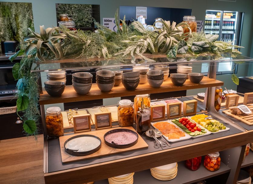 Trafo Hotel Baden breakfast buffet with bowls, fruit, pastries and glass display in Baden