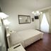 Suite Argentina in Rome guest room with double bed, desk, wall mirror and large window with drapes