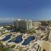 Sandos Cancun Lifestyle Resort in Cancún with oceanfront pools beside a wide sandy beach