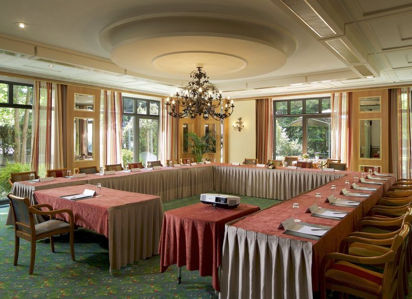 Hotel Parc Belair in Luxembourg meeting room with U-shaped table setup and chandelier