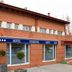 Partner Cisneros hotel in Madrid, brick exterior with blue awning and ground-floor entrance