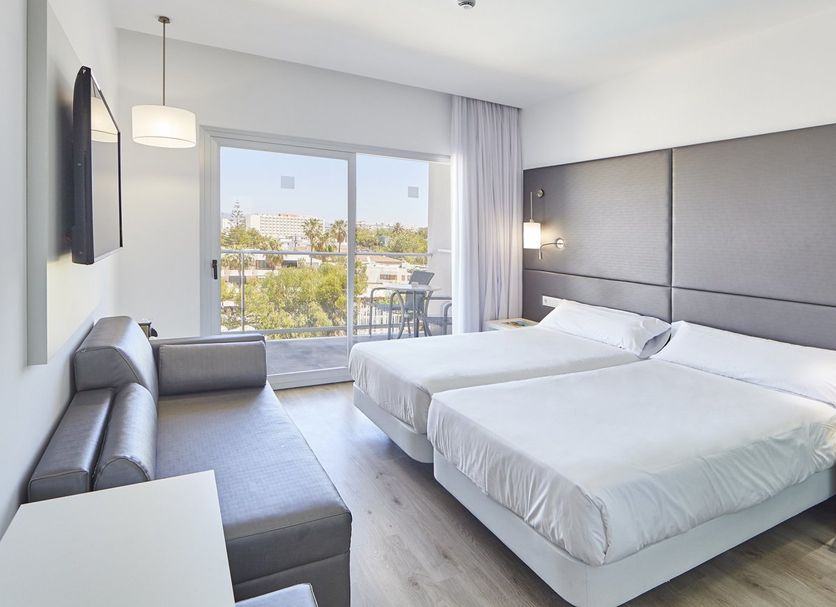 Hotel Astoria Playa Adults Only 4 Sup room in Alcúdia with twin beds, sofa, and balcony view