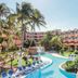 Be Live Experience Las Morlas in Varadero with a lagoon-style pool, palm trees and blue lounge chairs