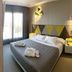 Hotel Macia Sevilla Kubb room in Seville with geometric headboard, king bed and window light