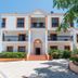 Alfagar Village in Albufeira, white three-story hotel exterior with balconies and central entrance
