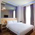 Check Inn Express Taichung Fuxing Hall 2 room with double bed, mirror wall and window curtains in Taichung City
