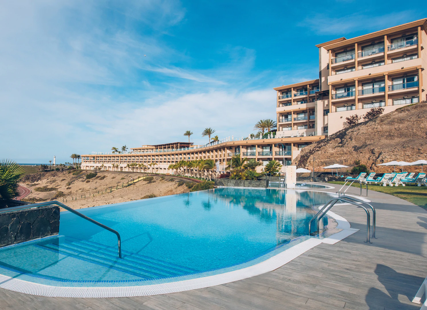 Iberostar Playa Gaviotas in Jandía with an infinity pool overlooking the ocean and resort buildings