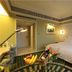 Grand Hotel Luxury International in Nanjing guest room with king bed, desk, fruit basket and city views