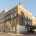 Amber Residence Hotel in London, exterior of a corner brick hotel building on a city street