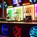 Seven Feathers Casino Resort in Canyonville bar with neon-lit counter and colorful backlit liquor shelves