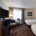 Seven Feathers Casino Resort in Canyonville guest room with two beds, desk, TV, and window seating