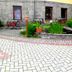 Rezydencja Pod Szczytami in Szklarska Poręba with landscaped courtyard, pavers, and outdoor seating