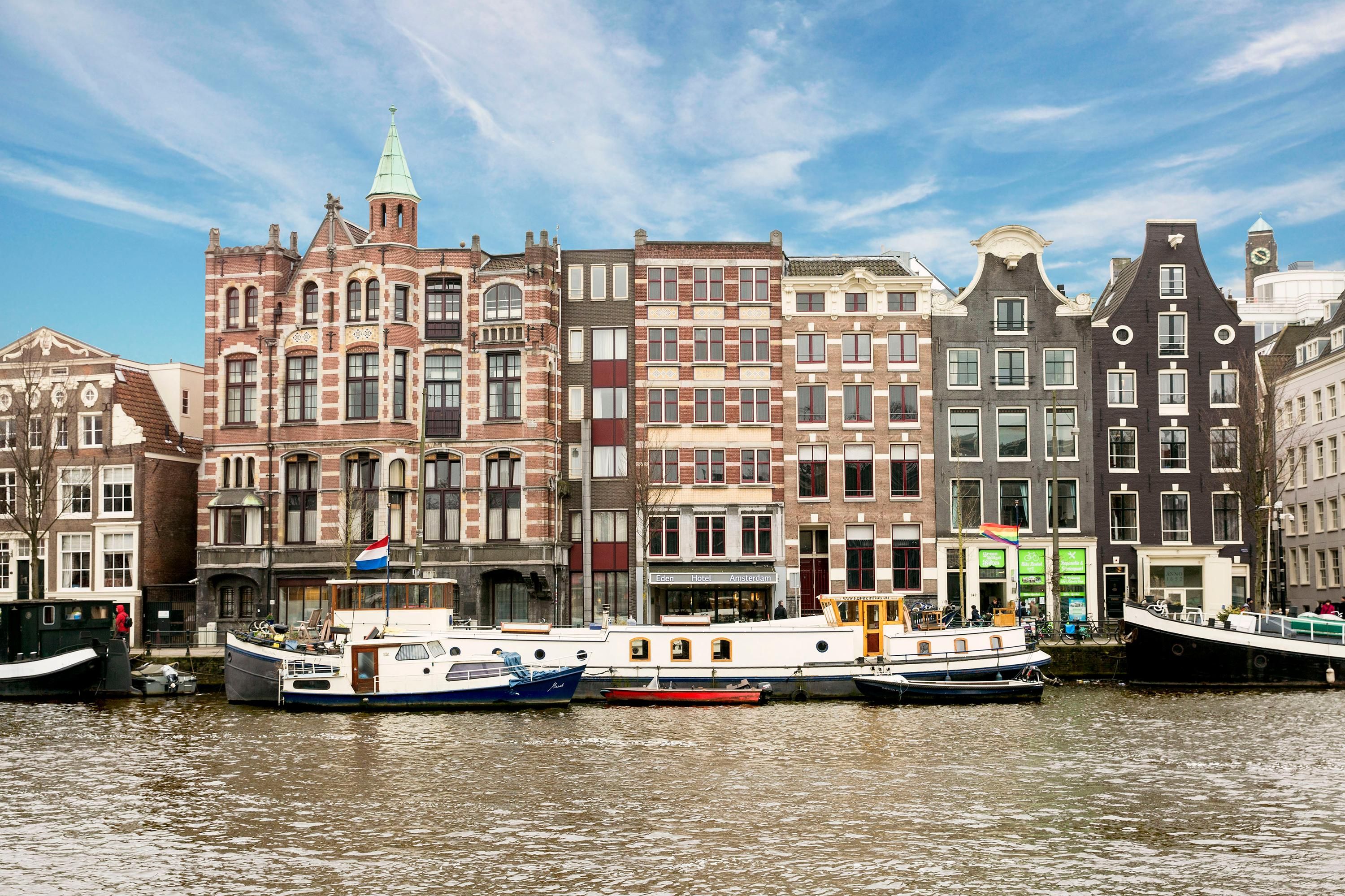 Eden Hotel Amsterdam in Amsterdam overlooking the canal and historic waterfront buildings