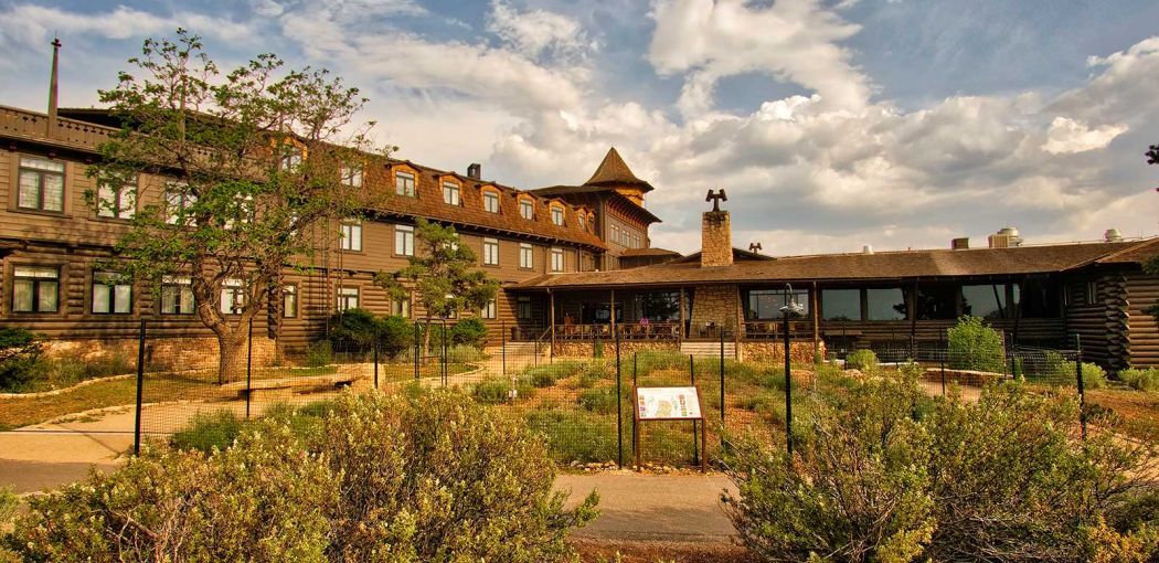 El Tovar Hotel in Grand Canyon Village with rustic lodge exterior and landscaped courtyard