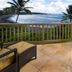 Hana Kai Maui in Hana balcony with wicker chairs and sweeping ocean view