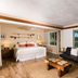 Hana Kai Maui in Hana guest room with ocean view, bed, sofa and coffee table