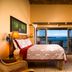 Hana Kai Maui room with loft stairs and ocean view balcony in Hana