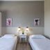Argyro Rent Rooms in Kritsa twin bedroom with two single beds and bedside lamps
