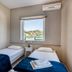 Argyro Rent Rooms in Kritsa with twin beds and a window view of hills