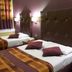 Frederick House Hotel in Edinburgh guest room with two twin beds, plaid bedding and wall sconces