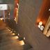 Alegria Plaza Paris in Lloret de Mar: illuminated staircase with glass railing and wall sconces
