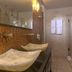 In Fashion Hotel & Spa bathroom in Playa del Carmen with dual vessel sinks and mosaic tile wall
