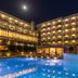 Ariti Grand Hotel Corfu in Kanoni with illuminated pool and lit balcony views at night