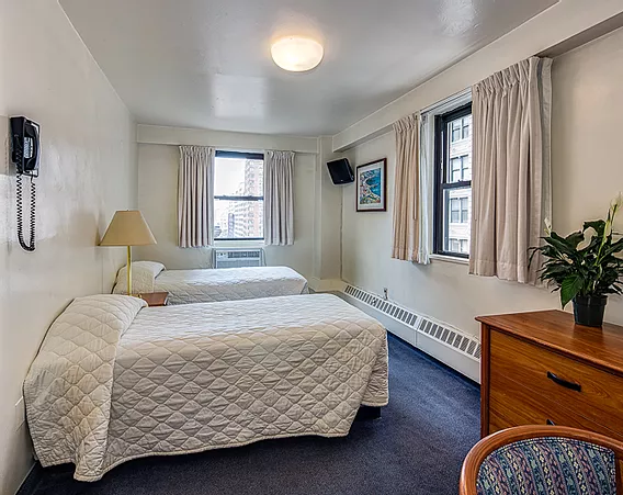 Seafarers International House in New York guest room with two beds and city-view windows