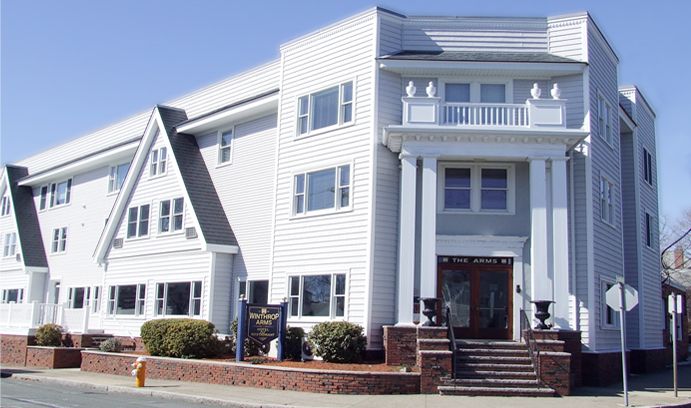 Winthrop Arms Hotel Restaurant Logan Airport in Winthrop, white three-story hotel exterior with columned entrance