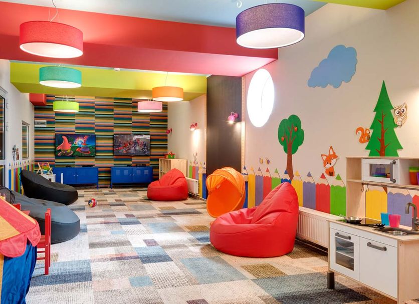 Akces Medical Fit Spa in Dźwirzyno colorful kids' playroom with bean bags and wall murals