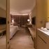 Golden Lake Hotel in Jinhu Township guest room with bed, desk, and warm wood accents