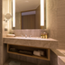 Golden Lake Hotel, Jinhu Township bathroom vanity with large mirror and lit wall sconces
