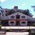 Hotel Jeet Paradise in Phaltan, exterior entrance framed by palm trees and landscaped steps